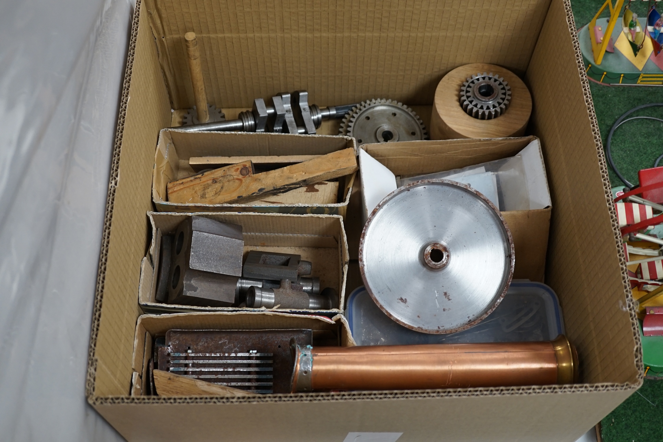 A partially constructed kit comprising of the major components of machined and cast parts to build a two inch scale live steam Ransomes 4 N.H.P. traction engine, including a set of drawings